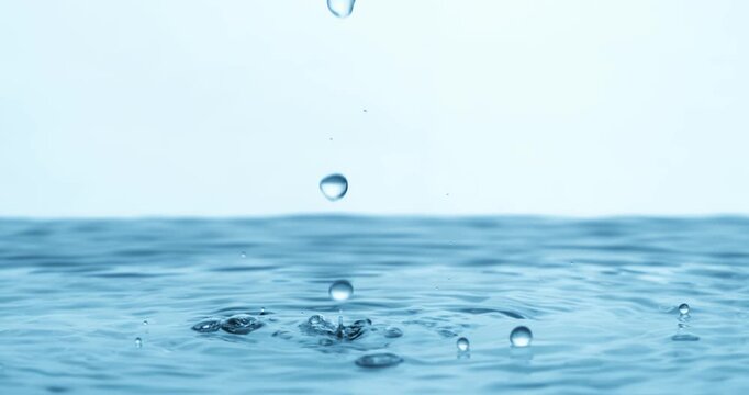 Water Drops close-up of water falls in a super slow motion. Shot on super slow motion camera 1600 fps.