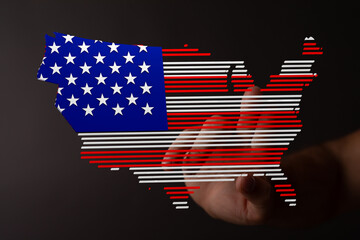 Digital illustration of a hand interacting with a US map designed as an American flag.