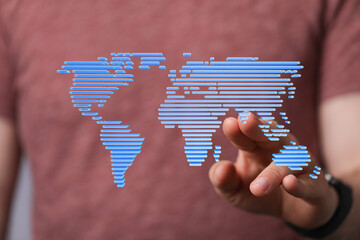 Hand interacting with a digital world map.  Global network, technology, connection concept.