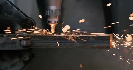 CNC Laser cutting of metal, modern industrial technology Making Industrial Details. Shot on super slow motion camera 1000 fps.