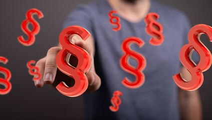 Abstract image of a hand reaching for red paragraph symbols.  Perfect for legal, law, and justice...