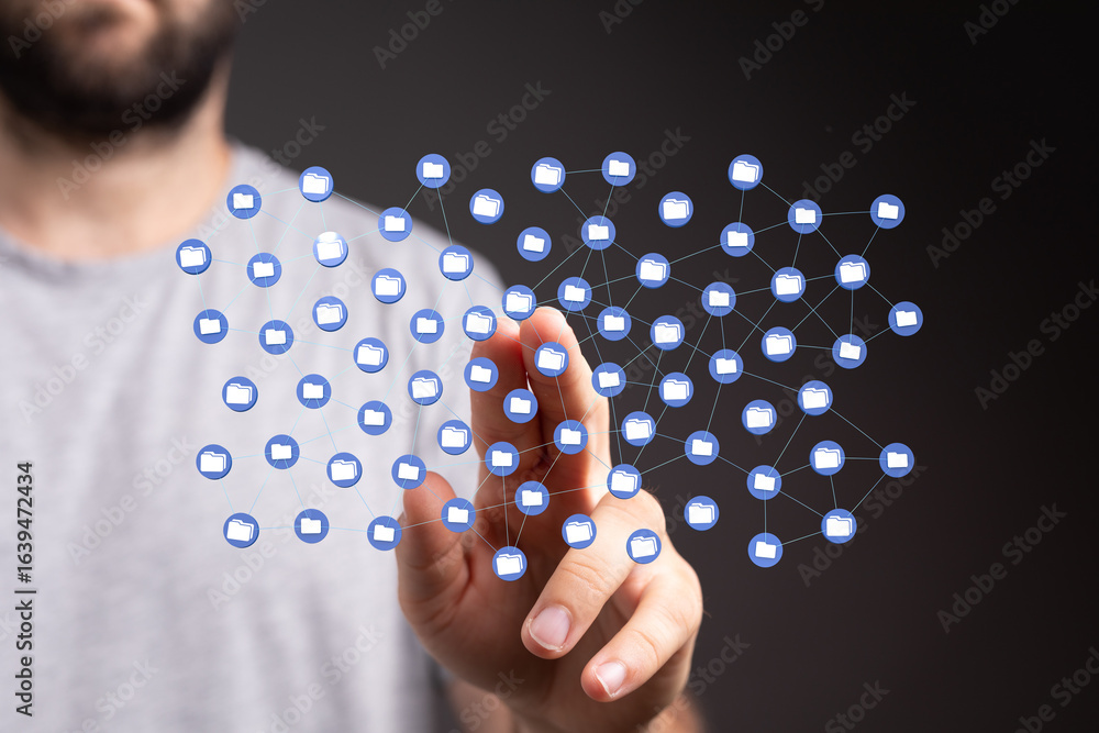 Poster image depicts a person interacting with a visual representation of a network of digital folders, sym