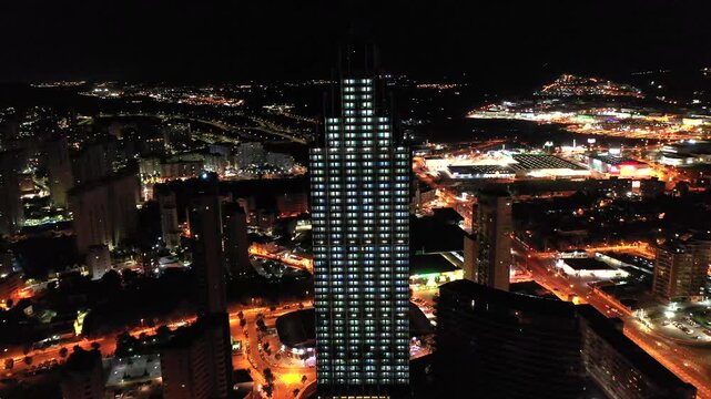 Aerial nocturne view of the skyscrapers of Levante Beach an city center in the Mediterranean city of Benidorm, Spain.