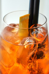 Aperol spritz cocktail with bubbles and orange garnish