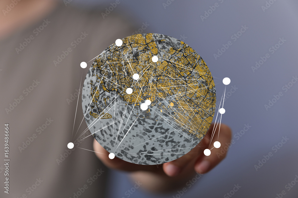 Poster abstract image of a person holding a digital globe showing network connections and city map. perfect
