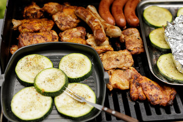 Delicious grilled chicken and sausages with grilled zucchini. Perfect summer BBQ!