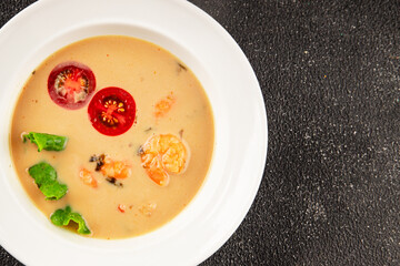Tom kha soup shrimp, coconut milk, miso paste tasty seafood snack fresh delicious gourmet food background on the table rustic food top view copy space pescetarian diet
