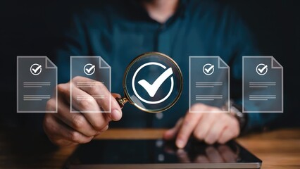 Businessman reviewing documents with magnifying glass, ensuring quality and approval for business success
