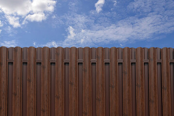 Modern brown metal picket fence