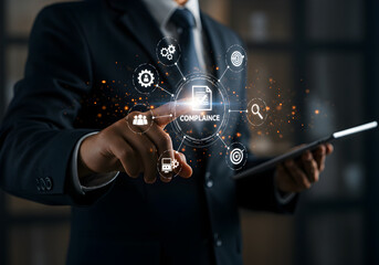 Businessman managing business compliance on a virtual screen. A concept of corporate governance and regulation, with a manager ensuring adherence to policies, standards, and legal requirements.