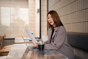 Businesswoman analyzing financial graphs, calculating company expenses, and planning investments, corporate, accounting.