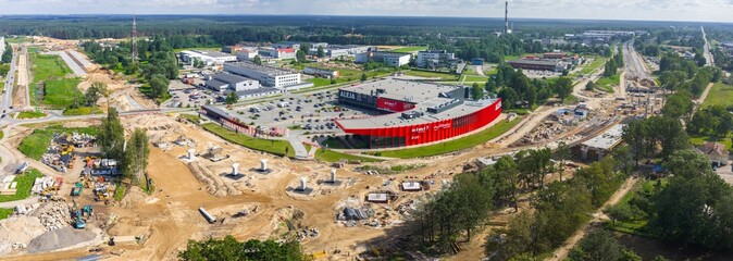 Large road construction site on Riga to Jelgava road, featuring heavy equipment, bridge supports,...