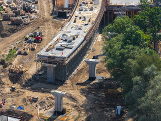 Active construction site on Riga to Jelgava road in Latvia, featuring a partially built bridge with...