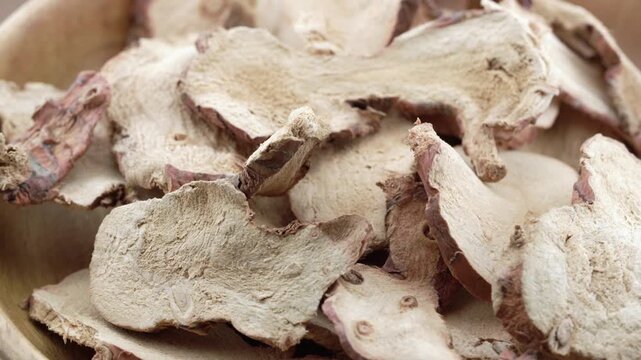 closeup pile of dry galangal root food rotate rotation food video footage background