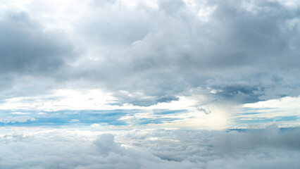 Beautiful white dense clouds Miraculously pulling up a group of clouds. Clouds floating above the...