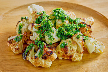 roasted cauliflower topped with fresh cilantro chimichurri