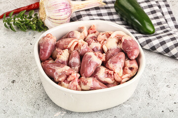 Fresh raw chicken hearts in the bowl
