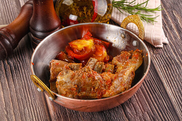 Baked lamb ribs with vegetables