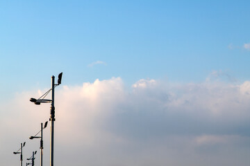 view of the cloud and street lights in a row