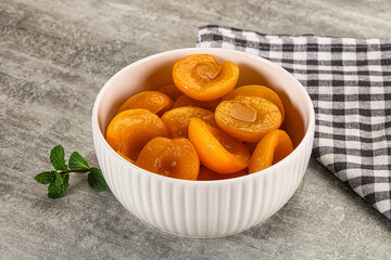 Sweet canned apricots with syrope