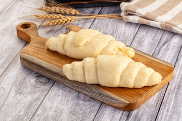 Raw uncooked croissant for bake