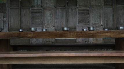 water containers arranged neatly on a wooden table