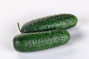 Ripe green raw two cucumbers
