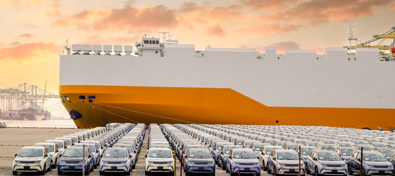Close up vehicle carrier vessel loading car for shipping to worldwide, Large RoRo (Roll on off) vehicle car carrier, New car lined up in the port for import export around the world.