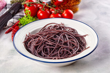 Boiled black rice noodles spaghetti