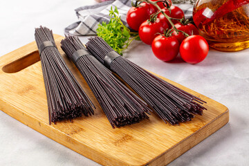Raw black rice noodles lines