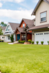 Close-up of a well-maintained green lawn leading to a cozy suburban house 