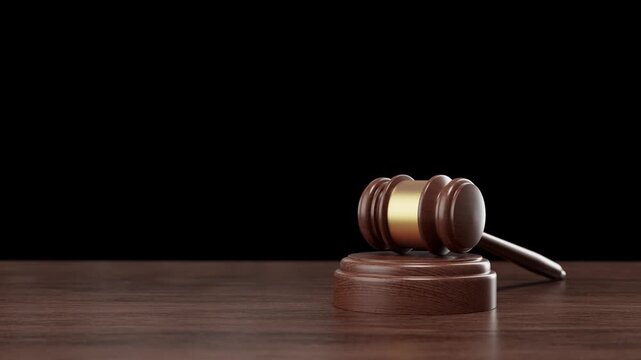 Judge's gavel resting on a dark wooden surface, presenting a classic legal symbol suitable for 3d render or animation