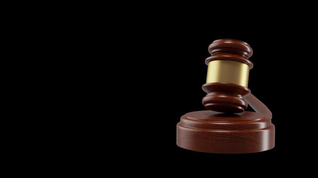 A wooden judge's gavel is the focal point of this image, set against a pitch-black background perfect for video composites or 3d renders