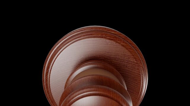 A high-quality 3d render of a wooden judge's gavel on a black backdrop suitable for video or animation keying