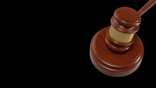 An isolated wooden gavel is positioned against a black background, ready for inclusion in video production or 3d animation