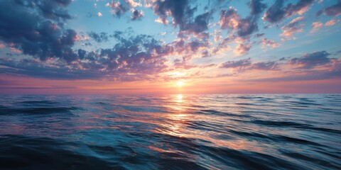 Obraz premium tranquil ocean at dusk, glowing sunset