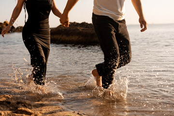 Couple in love running on water. Sea. Summer vacation.