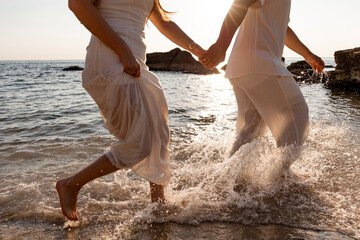 Couple in love running on water. Sea. Summer vacation.