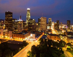 Fototapeta premium Cityscape at night, illuminated by lights from buildings and vehicles.