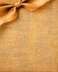 Rustic Burlap Background with Tied Bow: Textured Fabric for Design