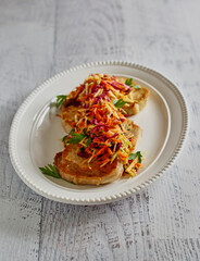 pan roasted pork chops topped with apple cabbage coleslaw