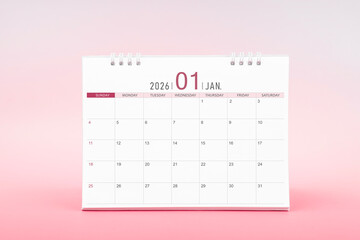 January blank desk calendar for 2026 year on pink color background.