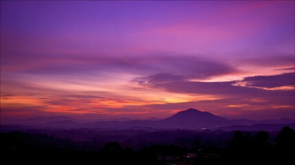 Obraz premium Dramatic sunrise and sunset sky with vibrant clouds, showcasing warm and cool color contrasts in a panoramic view.