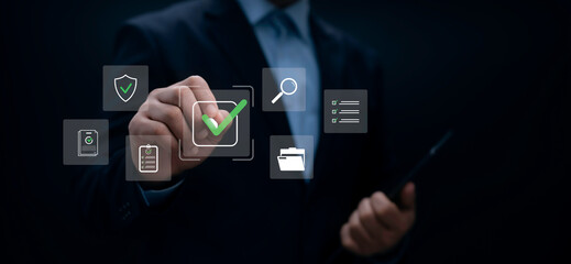 Businessman using digital checklist system for task approval verification secure document review and data management with modern interface icons for quality control compliance and productivity