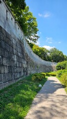 Stone Fortress Wall and Trees Against Blue Summer Sky, 성곽과 푸른 하늘