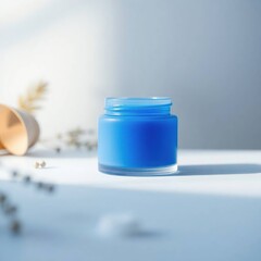 A vibrant blue cream jar holding a skincare product, set against a clean, minimalist background with natural light.