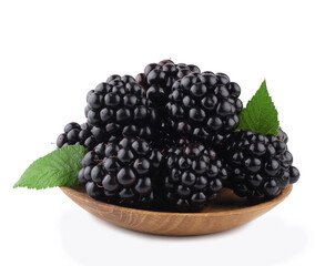 Blackberries in wooden plate isolated on white background
