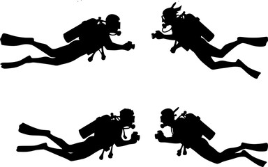 Silhouette of two scuba divers with cameras swimming underwater near coral and fish in the ocean water
