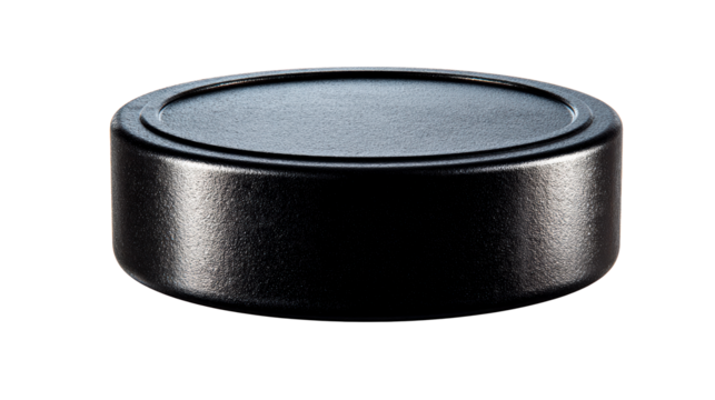 Textured black circular cap with raised rim on isolated white background