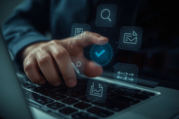 A person's hands are shown typing on a laptop computer keyboard in an office setting